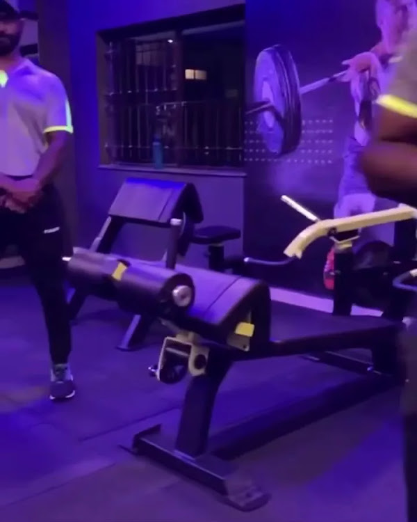 Workout Club training area with cardio equipment and group activity